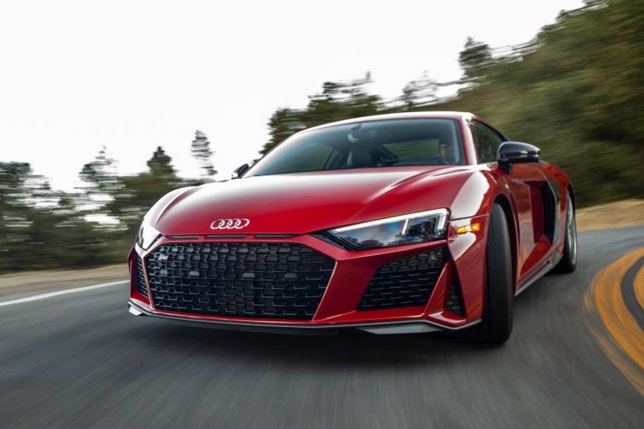 A red 2021 Audi R8 driving, the R8 is one of the best new sports cars with all-wheel drive
