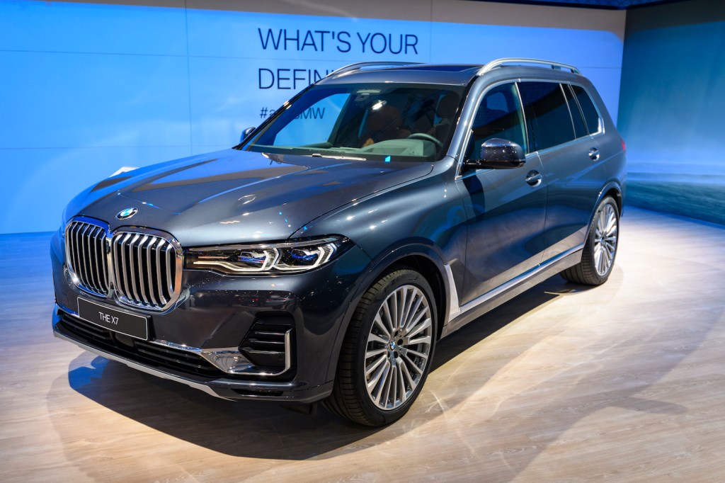 A BMW X7 at an auto show, the X7 is one of the best luxury SUVs for tall drivers