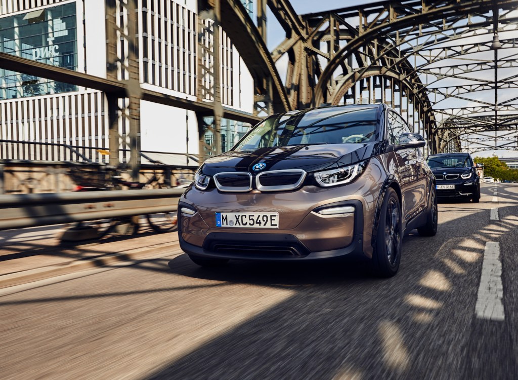 A 2021 BMW i3 driving, the 2021 BMW i3 is one of the best electric cars with over 100 MPGe