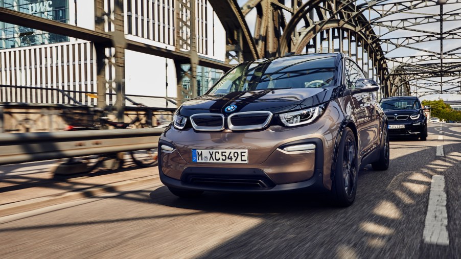 A 2021 BMW i3 driving, the 2021 BMW i3 is one of the best electric cars with over 100 MPGe