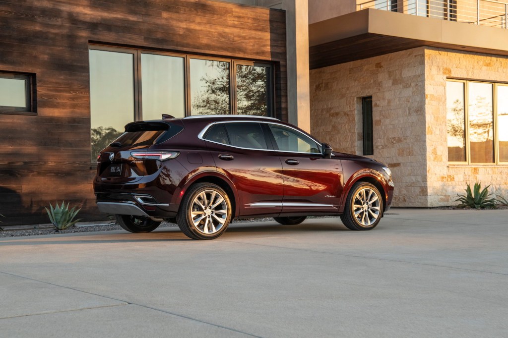 A 2021 Buick Envision parked in front of a house