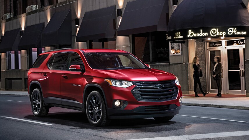A red 2021 Chevy Traverse parked at a traffic light