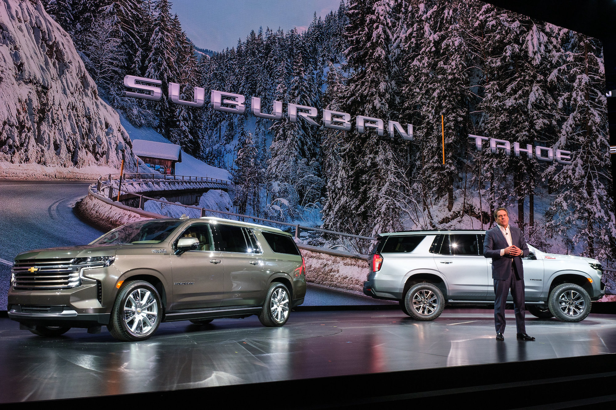 General Motors President Mark Reuss introduces the 2021 Chevy Suburban (left) and Chevy Tahoe on December 10, 2019, in Detroit, Michigan