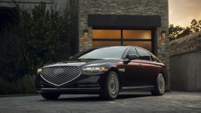 A maroon 2021 Genesis G90 parked, the G90 is one of the best luxury cars for tall drivers
