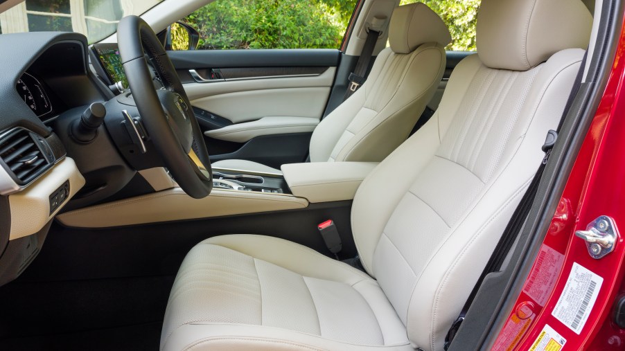 The white-leather front seats of a 2021 Honda Accord Hybrid