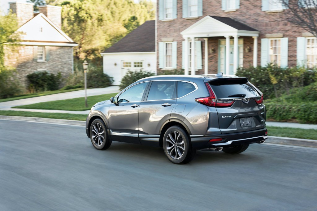 A 2021 Honda CR-V driving down a suburban street