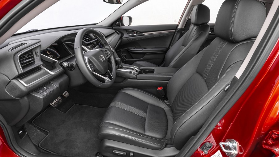 The dark-gray interior of a red 2021 Honda Civic Sedan Touring
