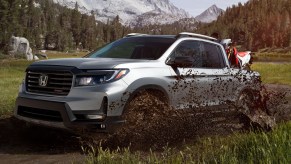 The 2021 Honda Ridgeline in a field driving off-road