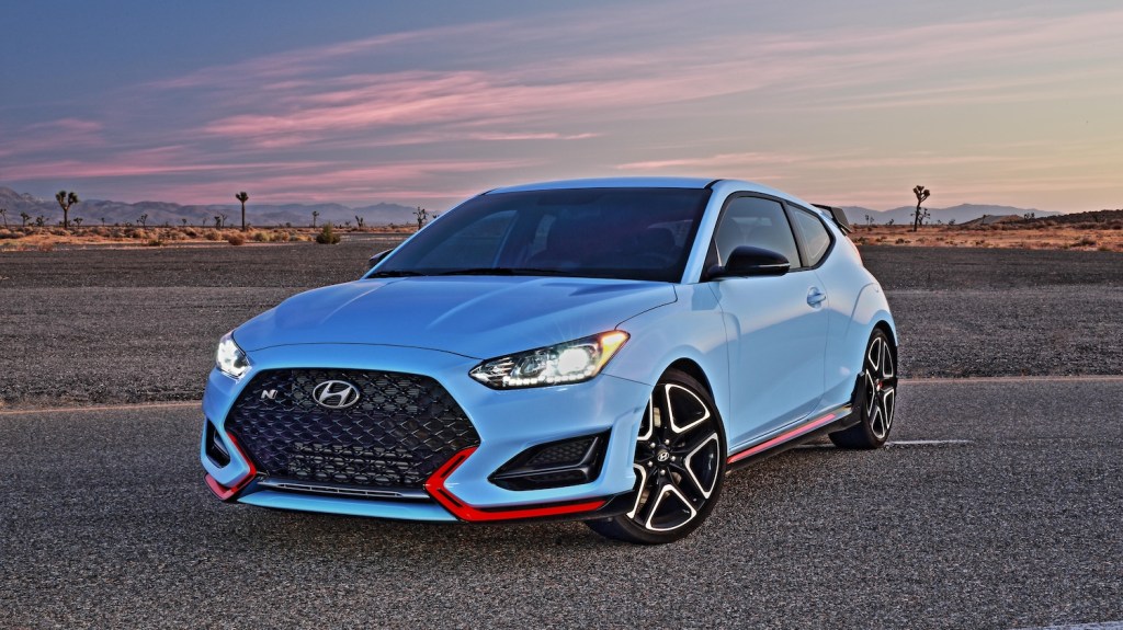 A blue 2021 Hyundai Veloster N at dusk, the 2021 Hyundai Veloster N is one of the fastest affordable new cars under $40,000