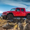 A red 2021 Jeep Gladiator, with a diesel engine, the 2021 Jeep Gladiator is one of the most fuel-efficient new pickups