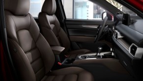 Black synthetic leather and suede front seats in a 2021 Mazda CX-5 compact SUV