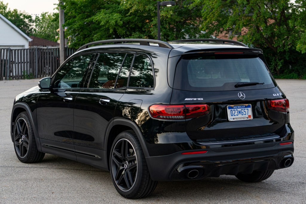 The rear 3/4 view of a black 2021 Mercedes-AMG GLB 35 in a parking lot