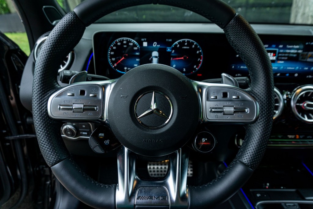 The steering wheel of a 2021 Mercedes-AMG GLB 35 with the AMG Drive Unit