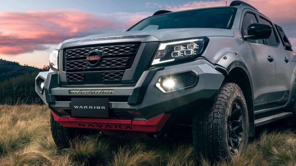 A gray Nissan Navara pickup truck is parked.