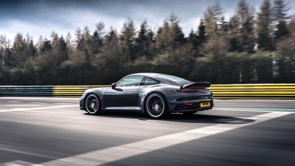 A grey 2021 Porsche 911 Carrera 4S Coupe on the track