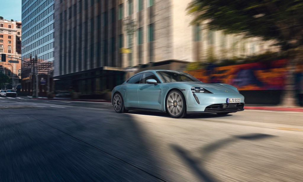 A light blue 2021 Porsche Taycan driving