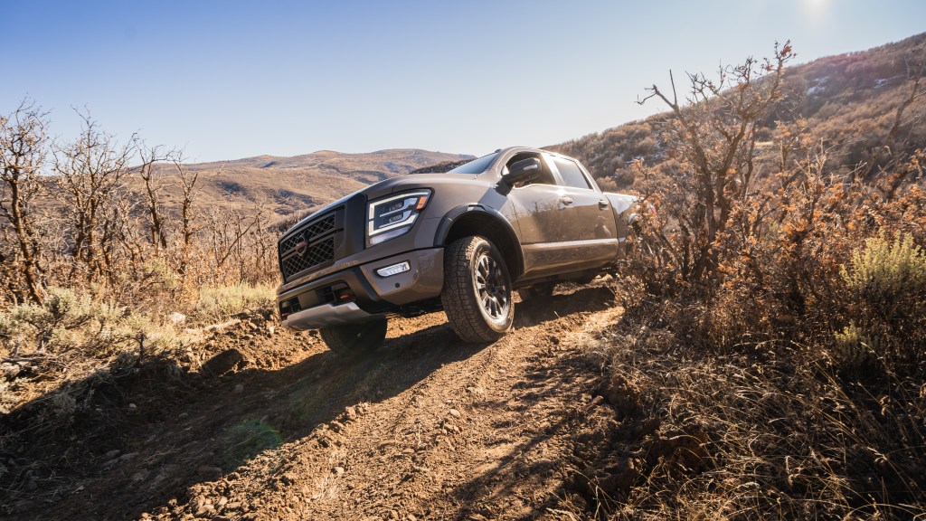 A Nissan Titan off-road, nose in the air