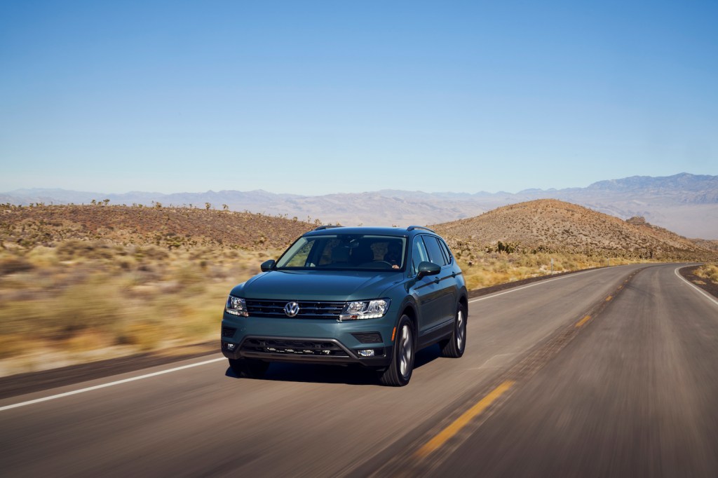A 2021 Volkswagen Tiguan driving, the 2021 Volkswagen Tiguan is a new compact SUV under $30,000