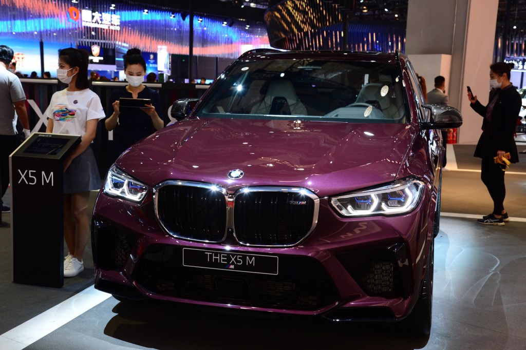 A purple 2021 BMW X5 luxury SUV on display