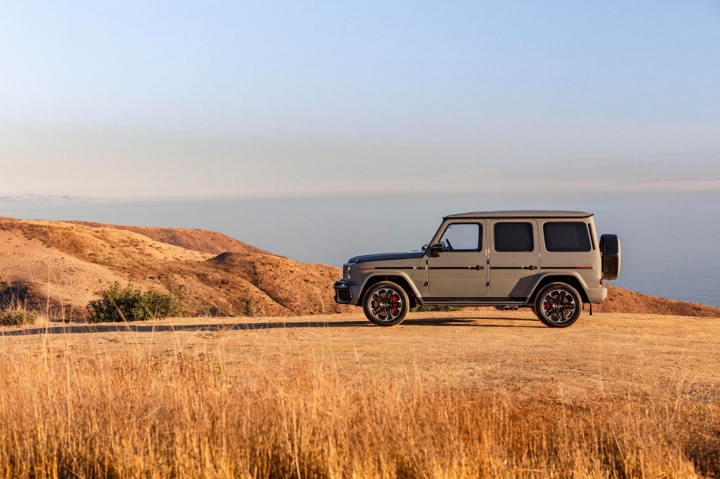 a 2021 Mercedes G-Class sitting on top of a mountain. This model is now the fastest-selling car in America