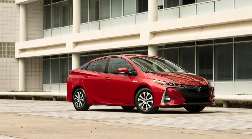 A red 2021 Toyota Prius Prime parked