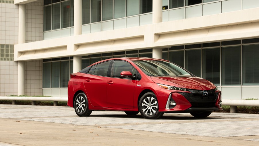 A red 2021 Toyota Prius Prime parked