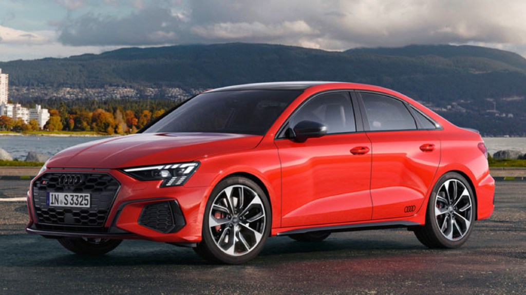 An orange 2022 Audi S3 sedan is parked.