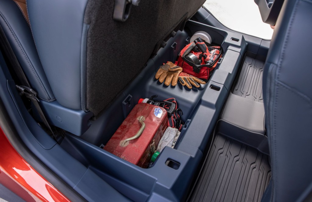 Various items in the underseat storage bins of a 2022 Ford Maverick EcoBoost Lariat