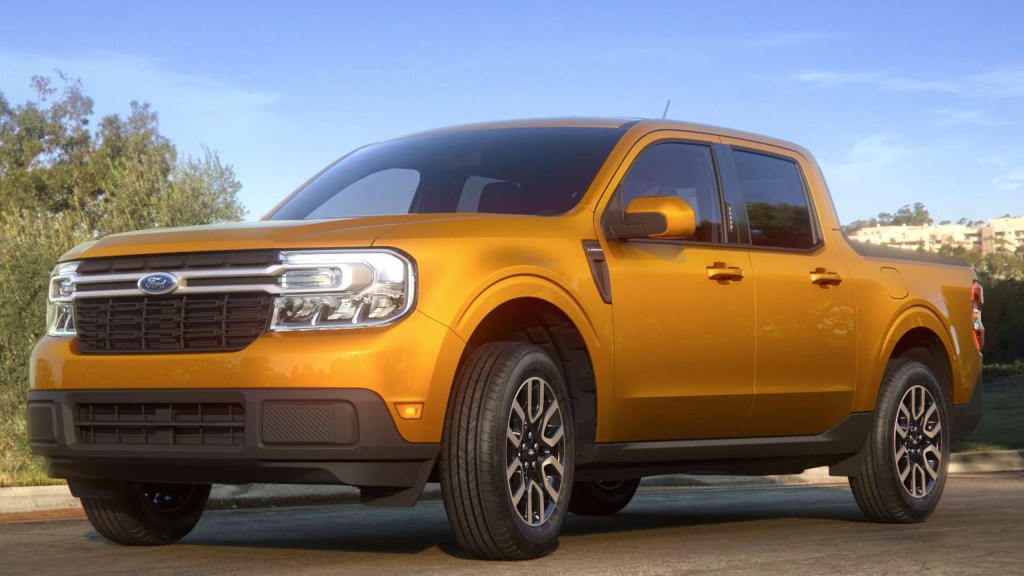 A yellow 2022 Ford Maverick small pickup truck is parked. 
