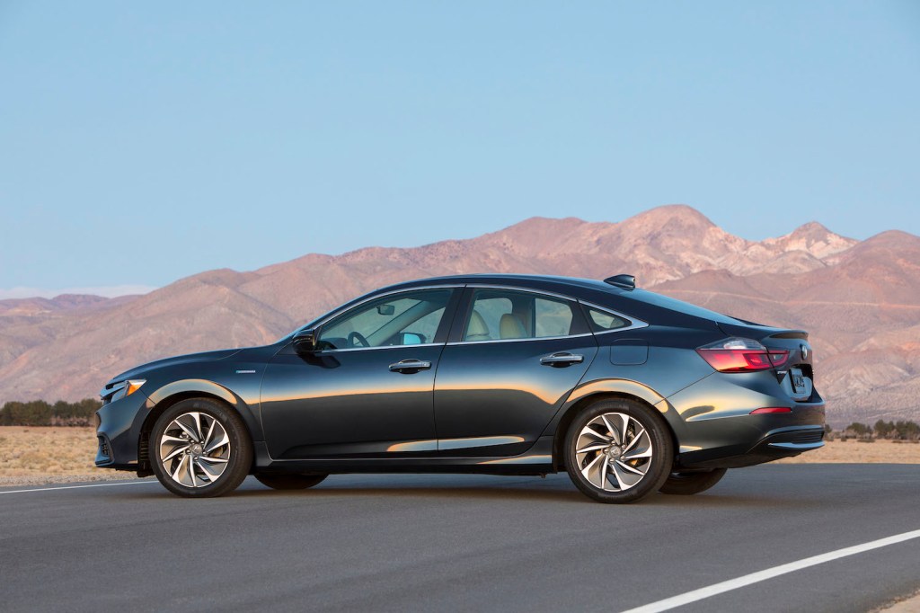 A black 2022 Honda Insight parked in front of a mountain range, the Insight is one of the best new cars under $40,000