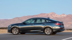 A black 2022 Honda Insight parked in front of a mountain range, the Insight is one of the best new cars under $40,000