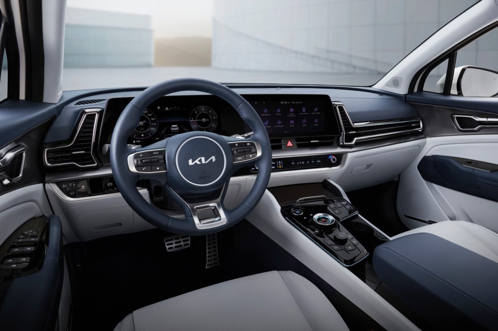 The blue and beige interior of the 2023 Kia Sportage