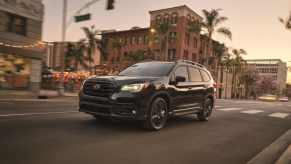 The 2022 Subaru Ascent Onyx Edition with black accents driving in the city