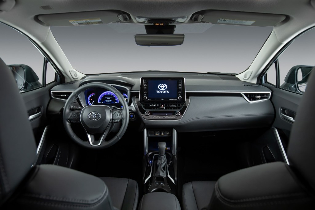 The gray front seats and dashboard of a 2022 Toyota Corolla Cross XLE AWD