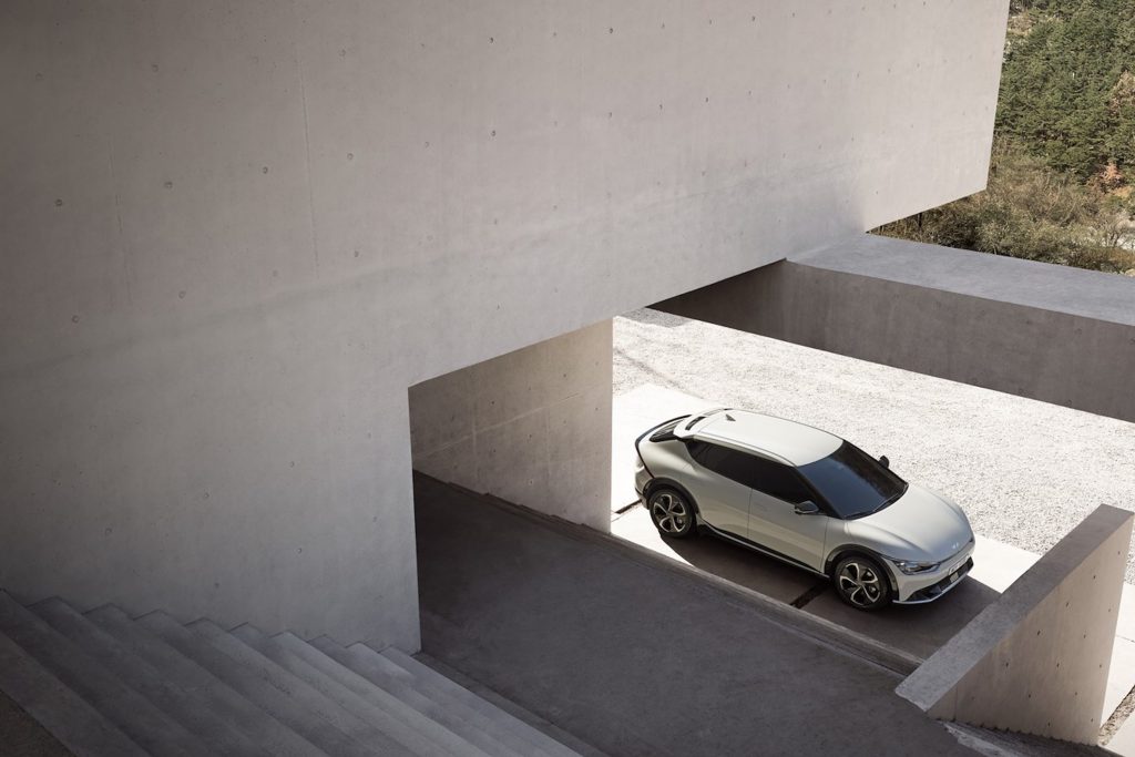 An off white Kia EV6 electric crossover parked outdoors