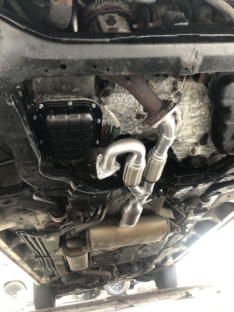 mechanical upgrades show beneath the Nissan Quest camper