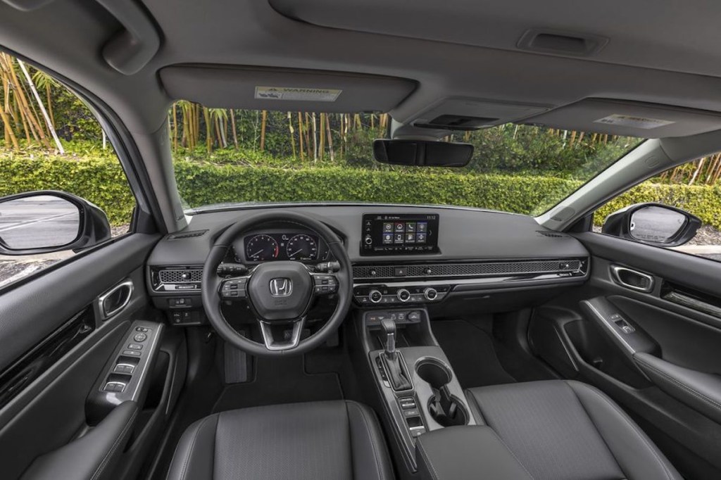 the 2022 Honda Civic interior. Front seats, steering wheel, and dash