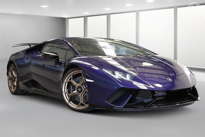 An image of a purple Lamborghini Huracan Performante held for auction.