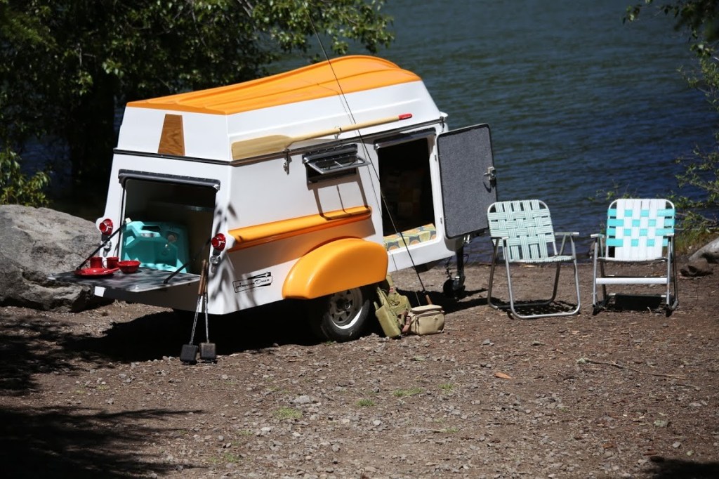American Dream Travel Trailer camping near a lakeshore