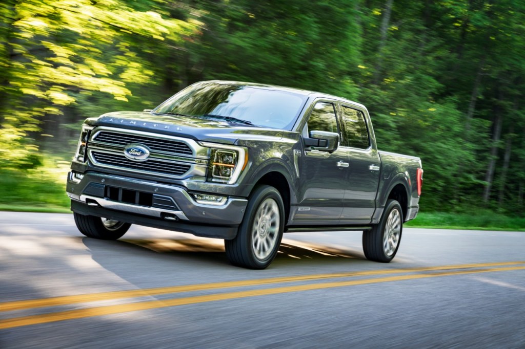 A 2021 Ford F-150 driving, the F-150 is a new diesel truck