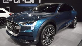 A blue Audi E=Tron EV on display