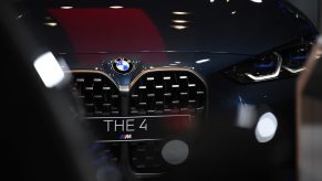 A black BMW 4 Series luxury automobile in the BMW Welt showroom, operated by Bayerische Motoren Werke AG, in Munich, Germany