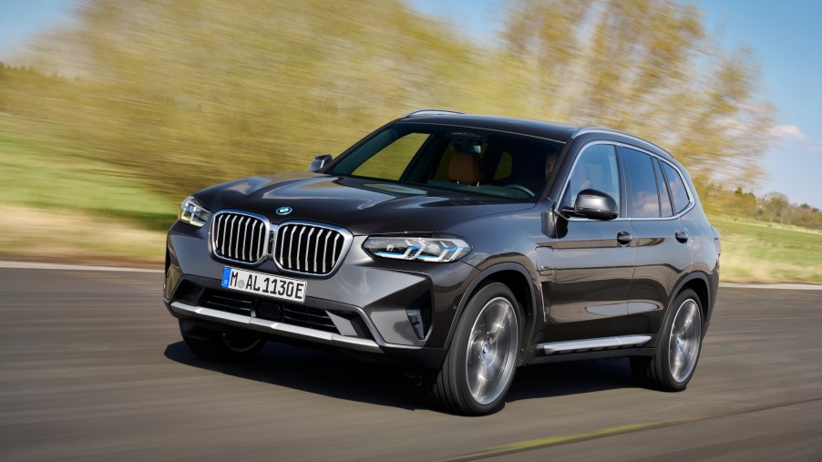The 2021 BMW X3 driving down a country road