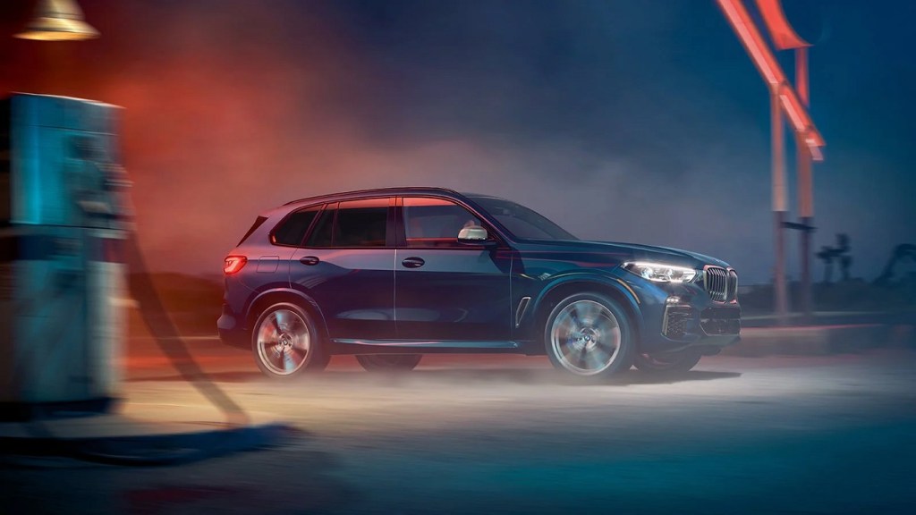 The side profile of a blue 2021 BMW X5.