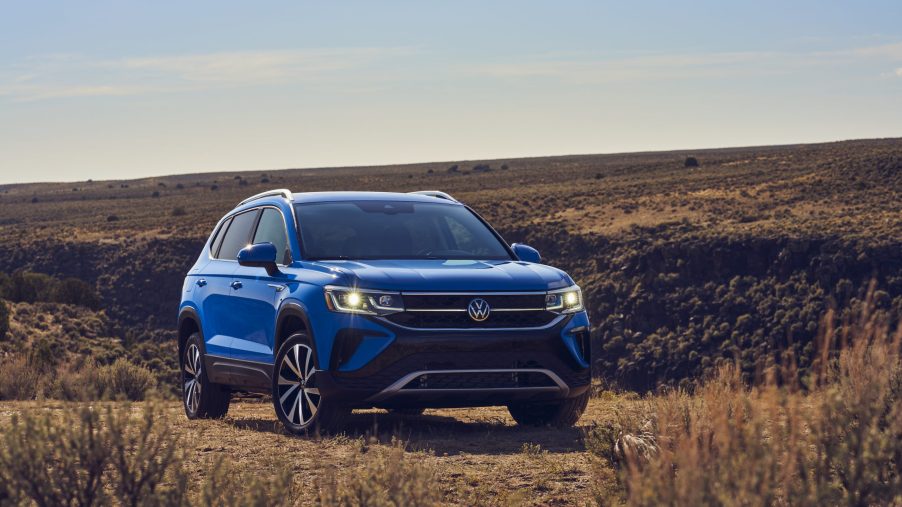 The blue 2022 Volkswagen Taos parked in the desert