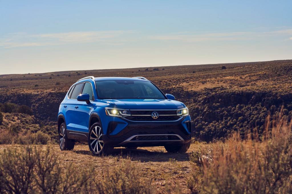 The blue 2022 Volkswagen Taos parked in the desert