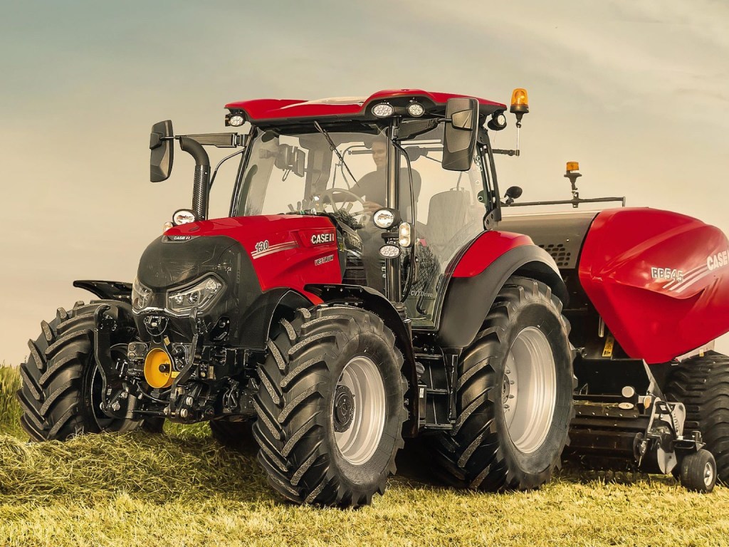 CASE IH VESTUM 130 CVX DRIVE tractor in a hay field hard at work