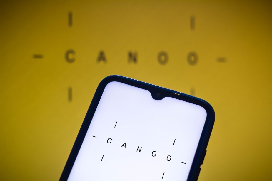 In this photo illustration, the Canoo Inc. logo is displayed on a smartphone screen