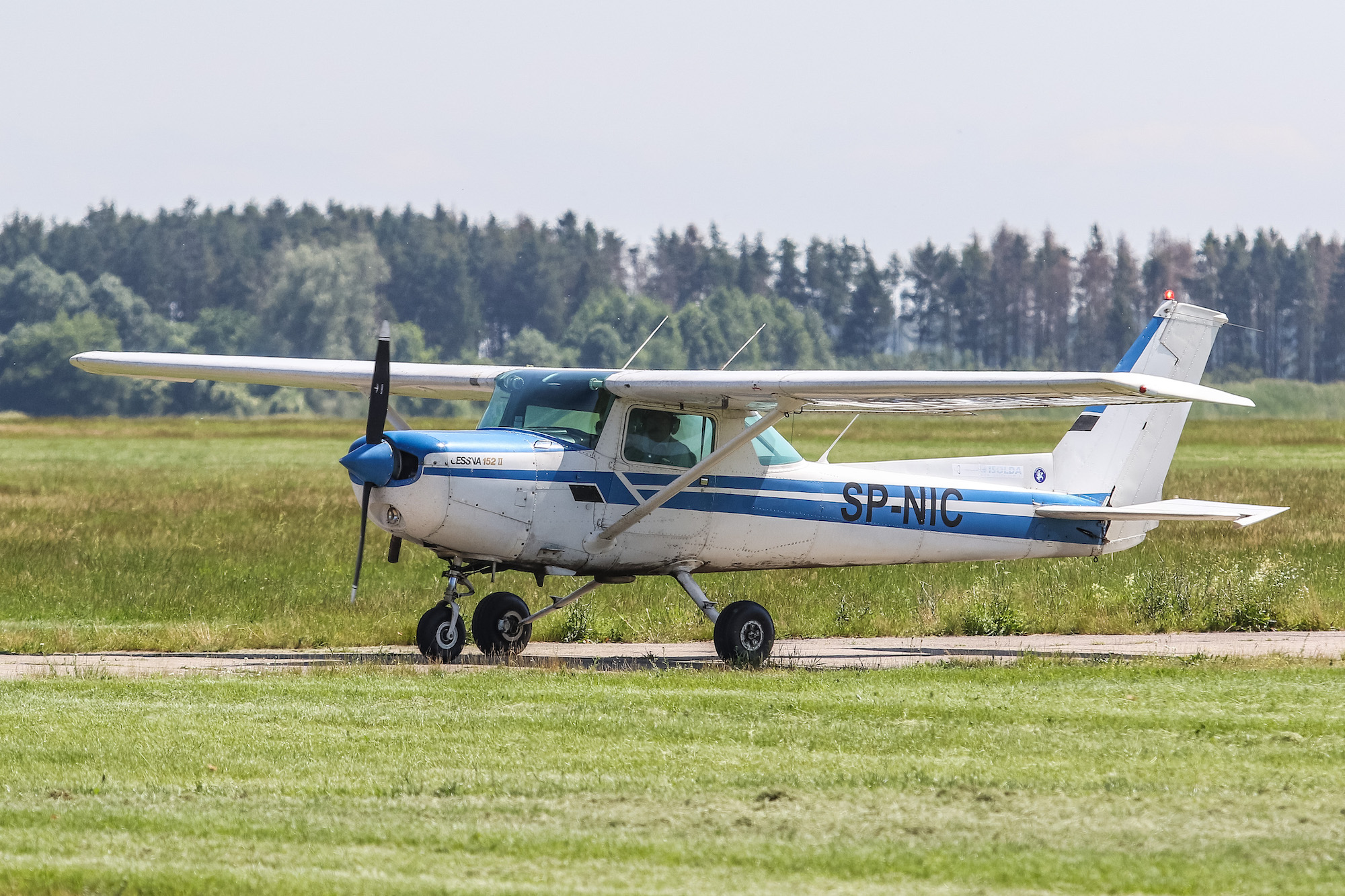 A Cessna 152 airplane taxies on small runway on June 14, 2019