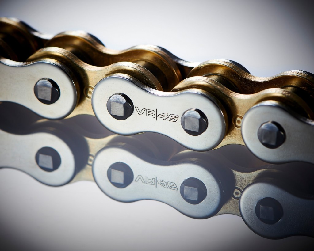 A close-up of one of the links on the D.I.D VR46 Valentino Rossi motorcycle chain showing the racer's 'VR46' logo